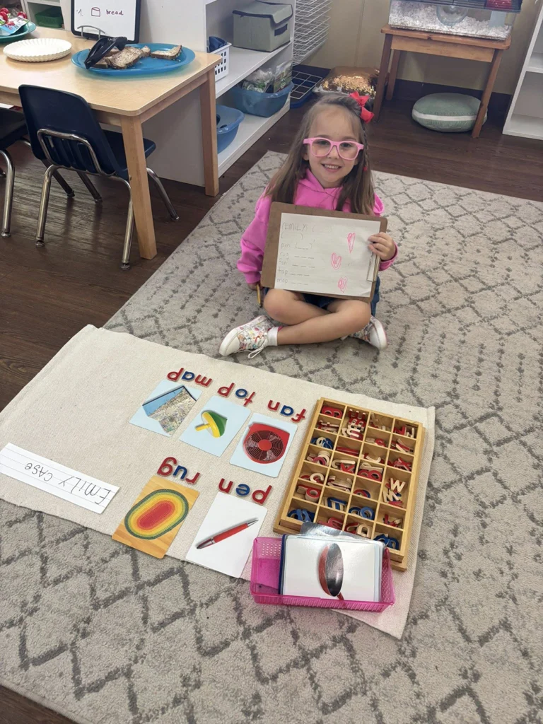 Child using movable alphabet letters during a Montessori language lesson